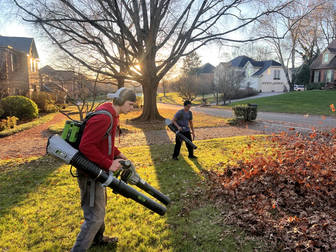 Clean Green crew using EGO blowers to gather leaves